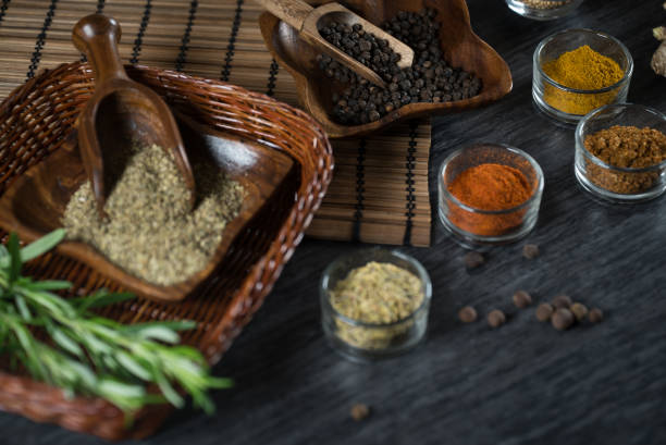 istock Selection of spices, herbs and greens. Grey stone background., copy space. 951174044