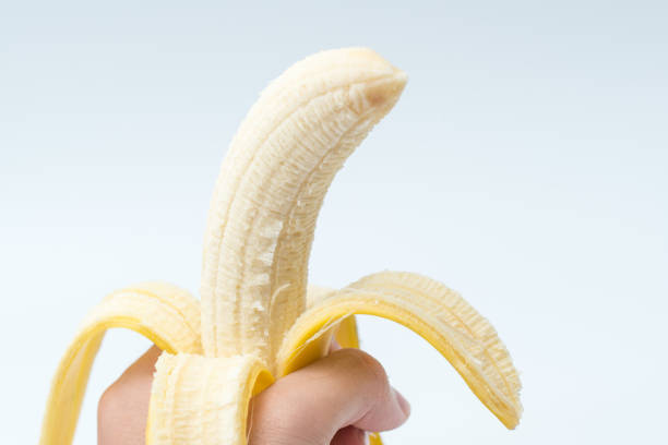 istock Human Hand Holding Banana Fruit Nutrition Concept 951177696