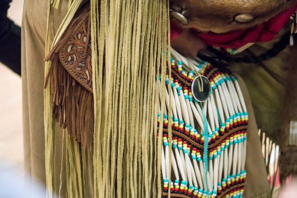 Mexico city, Mexico. January 2, 2022.Plaza de la Constitution (Zocalo) at the Mexican Capital is the stage of political events and cultural performances.Here an Aztec shaman officiates a purification ritual by blowing smoke to a woman.