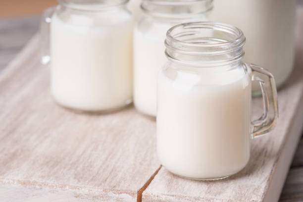 istock Jar with milk on a cutting board 951185810