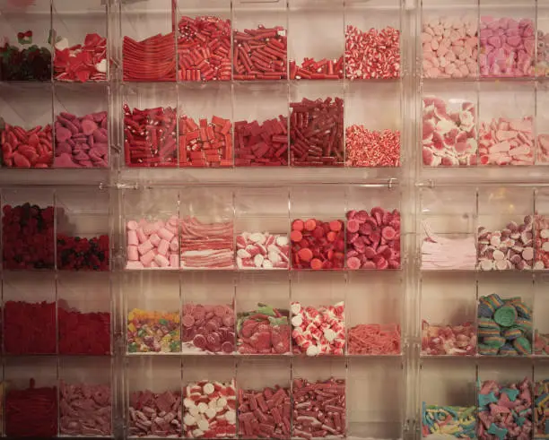 Photo of candys and sweets different colors in supermarket