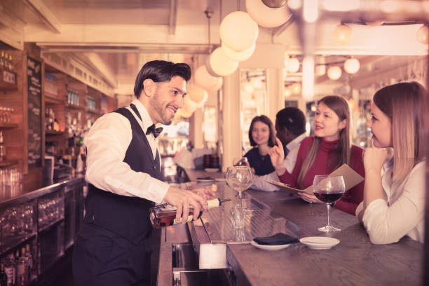 istock Barman serving shots at bar 951186626