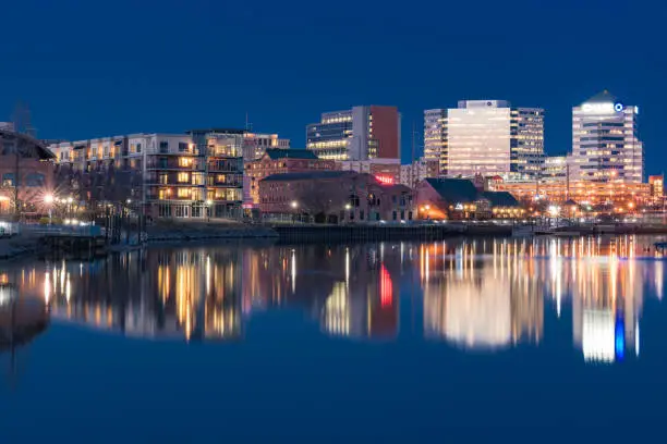 WILMINGTON, DE - APRIL 5, 2018: Wilmington, Delaware night skyline and Riverwalk  along the Christiana River