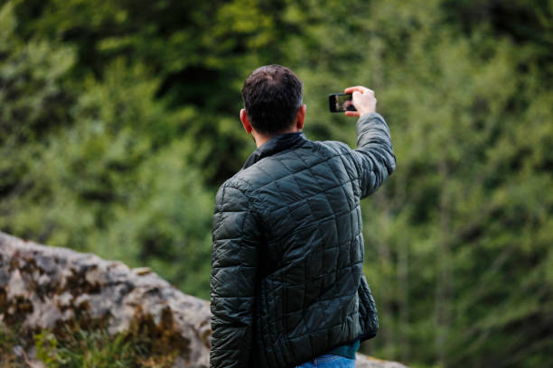 istock The man behind him is looking at the forest 951192626