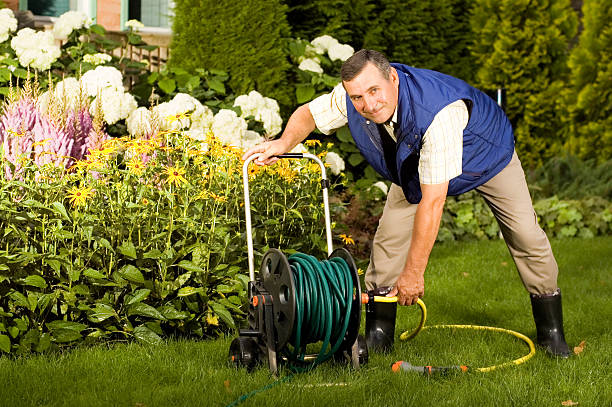 istock Senior man crimping hose in the garden 95120322