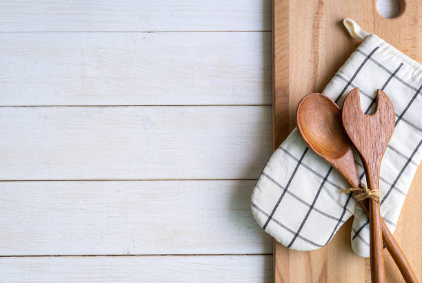 istock Kitchen utensils on wooden background with copy space 951204146