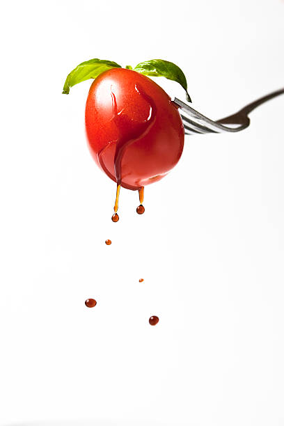 Cherry tomato on a fork. stock photo