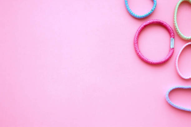 istock Elastic hair bands on pink background with free space 951209472