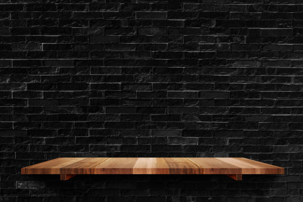 istock Empty wood board shelf at black brick wall background,Mock up for display or montage of product or design 951224714