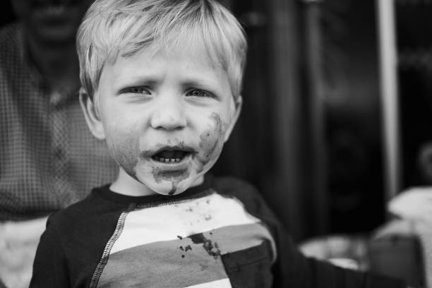 Little boy with smiling face enjoying icecream. Happy child eating ice cream.