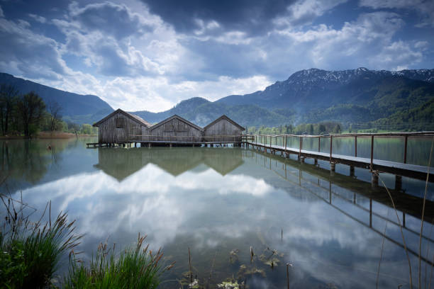 istock Jetty and boathouses at lake Kochelsee, Bavaria, Germany 951229218