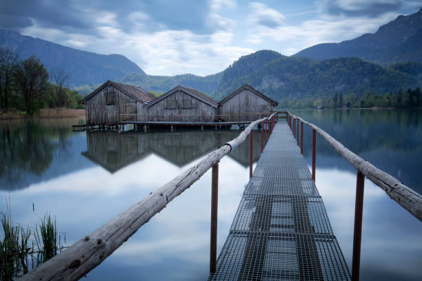 istock Jetty and boathouses at lake Kochelsee, Bavaria, Germany 951229242