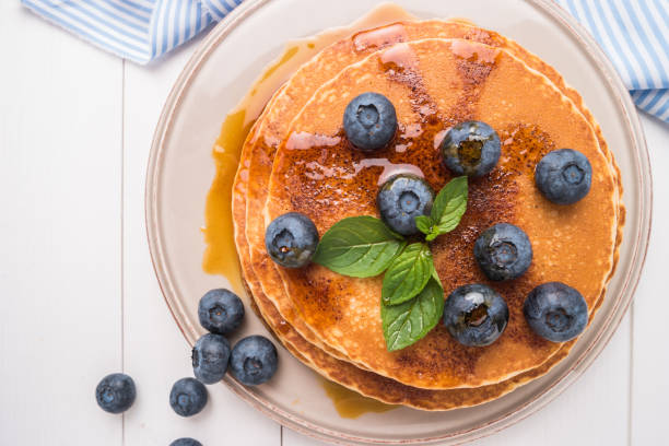 istock Stack of pancakes with fresh blueberry and caramel syrup 951229808