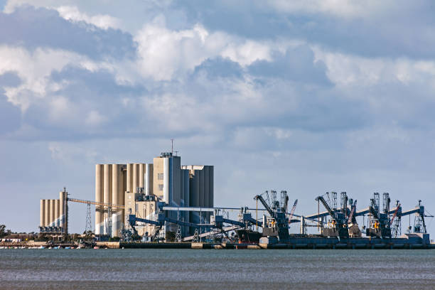 Deep water port for ships transporting grain with large silos and cranes in Trafaria, Almada, Lisbon, Portugal. Adequate for  Panamax and Capesize ships. Silopor maritime terminal
