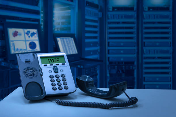IP Telephone device with data center room stock photo
