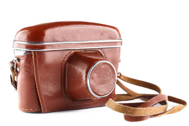 istock Vintage film camera in brown leather case. Isolated on white background 951235406