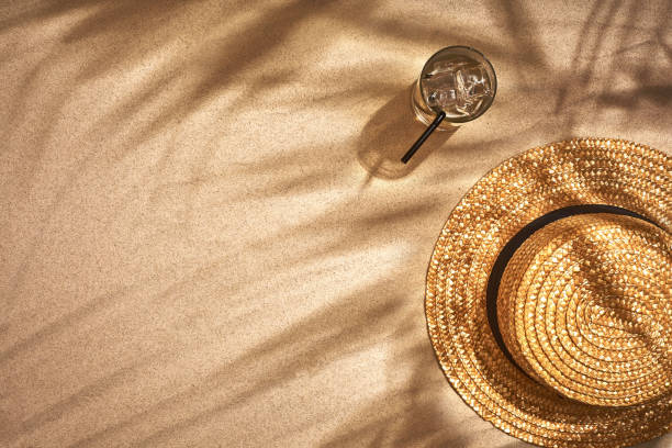 istock Top view of summer accessories on sandy beach 951237864