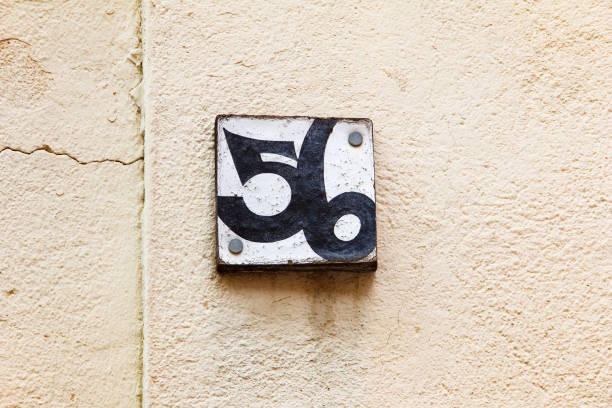 istock House number plate on old wall. 951242956