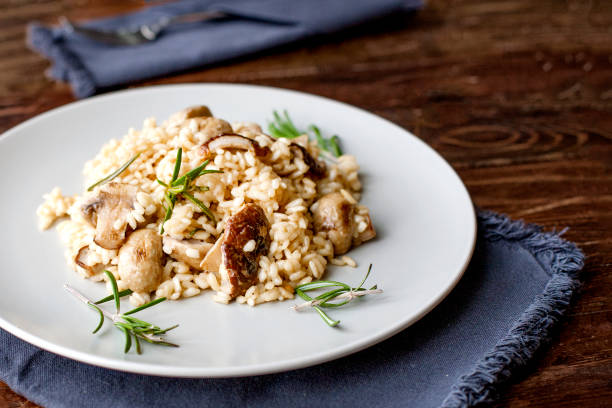 istock delicious rice with mushrooms and rosemary, risotto 951246994