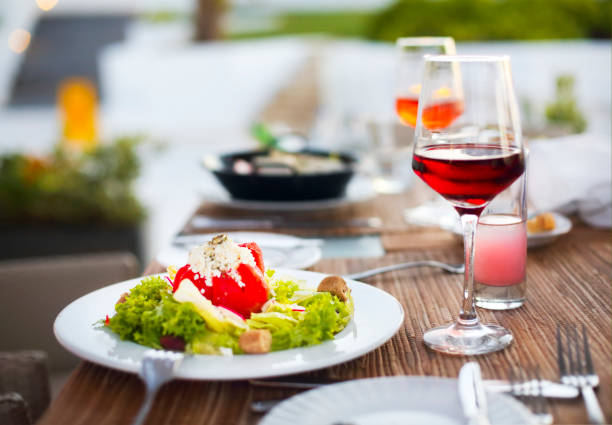 istock Dinner with vegetable salad and red wine 951250080