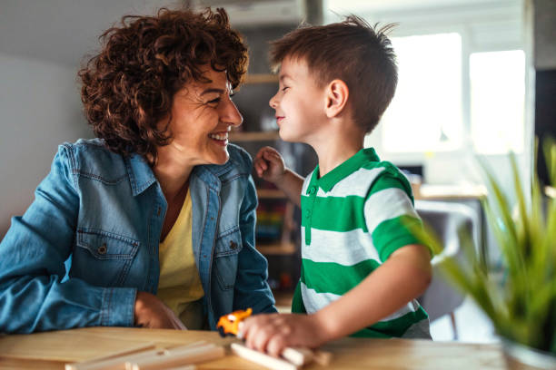 istock Mother and son having fun at home 951257238