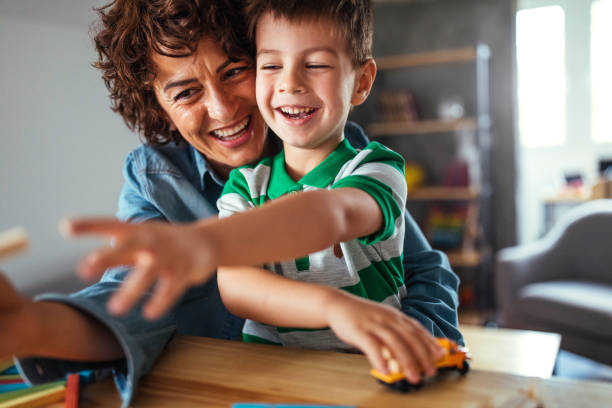 istock Mother and son having fun at home 951257330