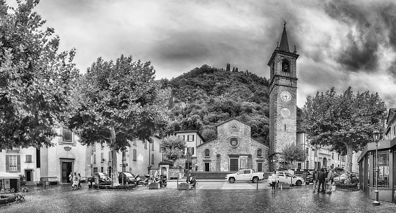 VARENNA, ITALY - SEPTEMBER 10: Panoramic view with facade of St. George's church in the town of Varenna, Lake Como, Italy, on September 10, 2017.