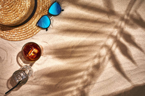 istock Top view of summer accessories on sandy beach 951270546