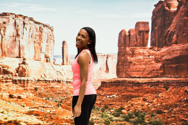 Attractive female standing out in the desert