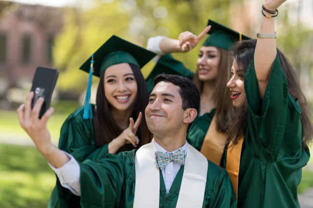 istock Diverse group of students taking a selfie at graduation 951277324