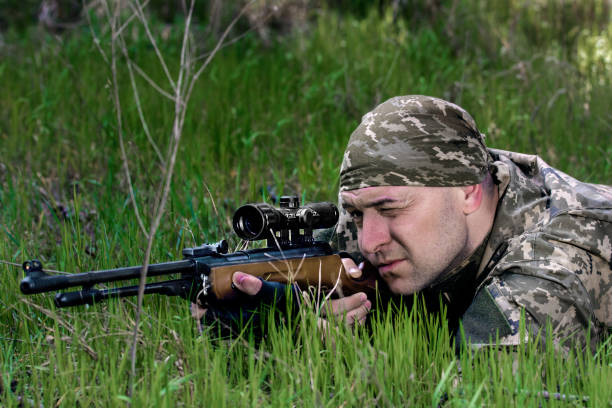 istock young man with an air rifle 951280768