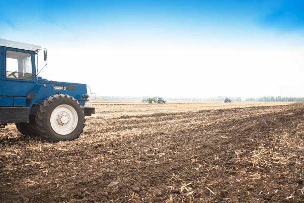 istock Old blue tractor in a empty field. Agricultural machinery, field work. 951283648