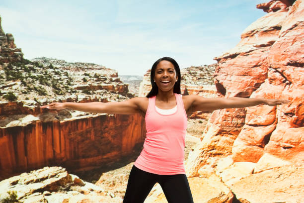 istock Beautiful female standing in the desert 951284240