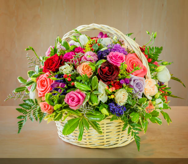 bouquet of flowers, multi-colored roses in a wicker basket