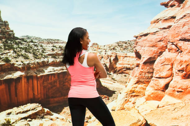 istock Beautiful female standing in the desert 951284406