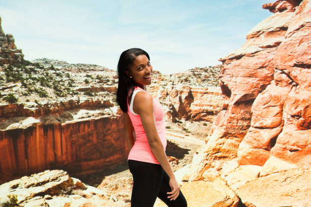 istock Beautiful female standing in the desert 951287978