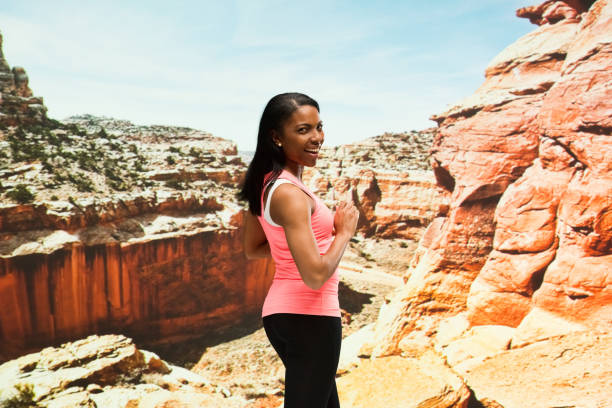 istock Beautiful female standing in the desert 951288204