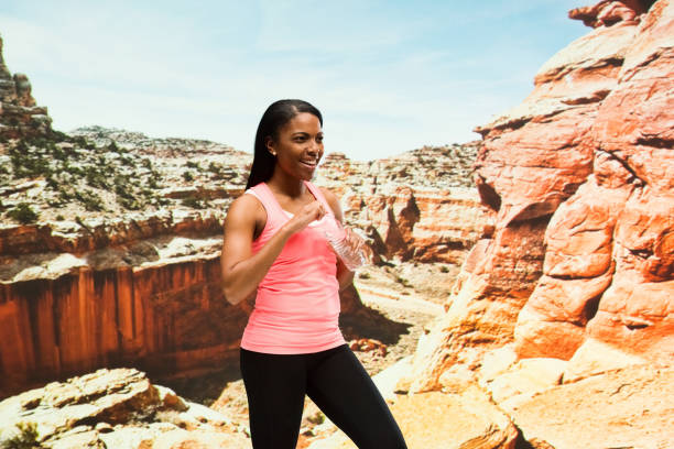 istock Beautiful female standing in the desert 951288208