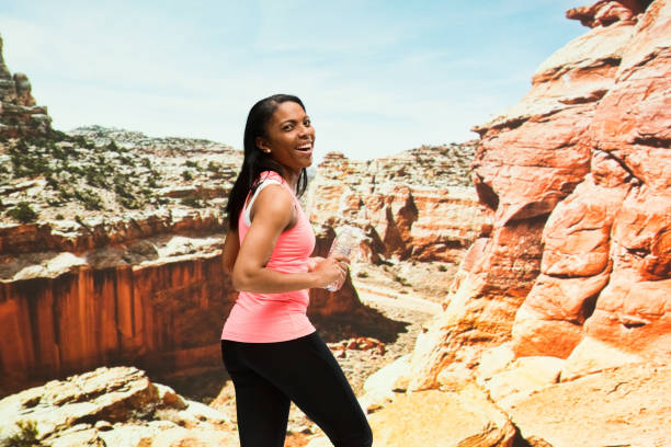 istock Beautiful female standing in the desert 951288210