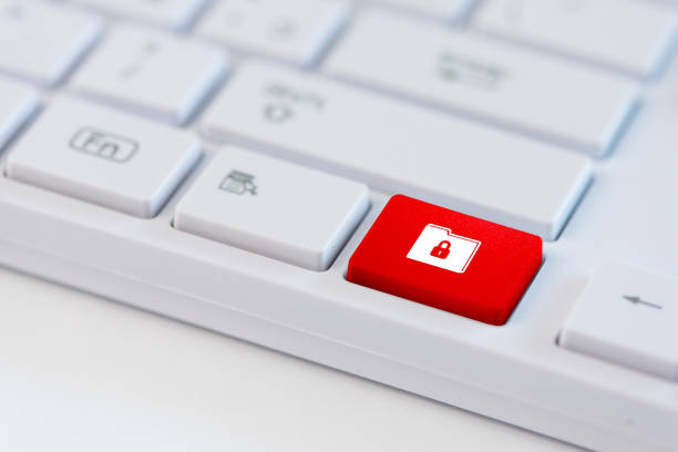 istock Red key with closed padlock icon symbol on a folder on laptop keyboard. Concept of data protection 951288262