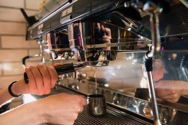 istock Barista with coffee holder near machine 951291302