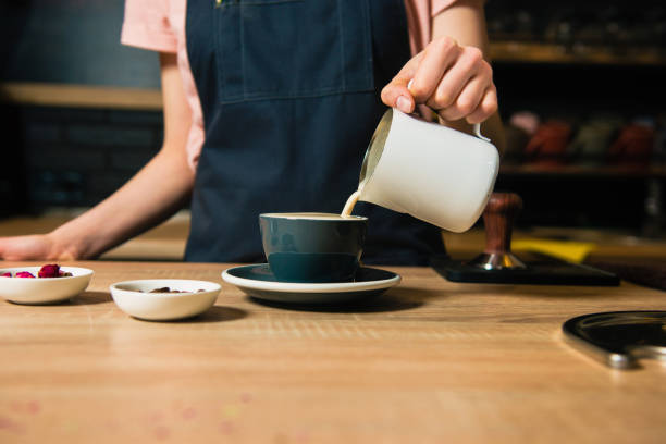 istock Barista pour out milk from pitcher 951291366