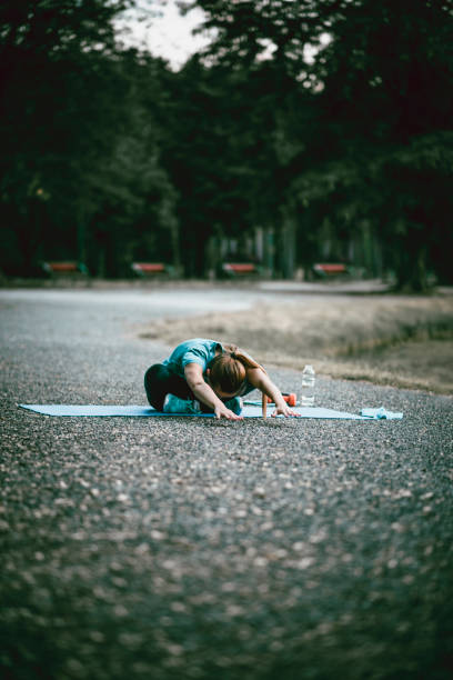 istock Young Women Doing Her Daily Exercise in the City Park 951300526