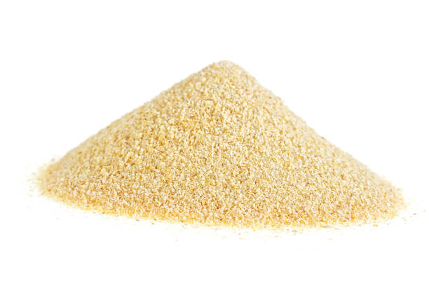 istock Dried granulated garlic on a white background 951304394