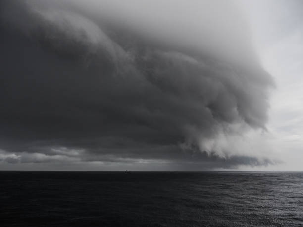 istock wild storm clouds at sea, black and white 951306648