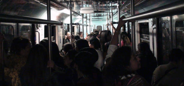Scenery Of Lots Of People Standing, Looking Around, Holding Hand On Handrail Inside Metro During The Rush Hour In Mexico City Mexico