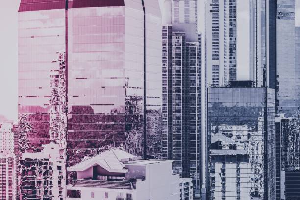 istock real estate background, modern building facade and skyscraper city skyline - 951307924