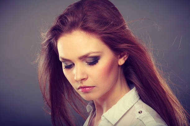istock Attractive brunette woman with windblown hair 951308964