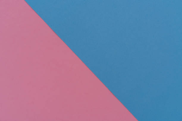 istock paper background, blue and pink divided by diagonal 951309382