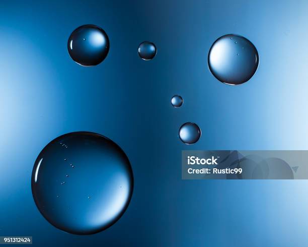 Water Droplets On Glass Blue Stock Photo - Download Image Now - Drop, Water, Black Background